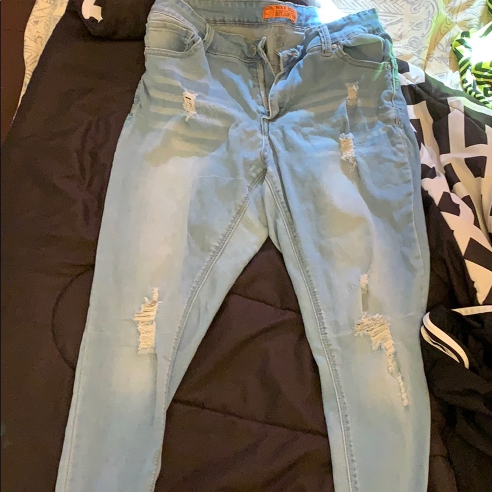 Light ripped blue jeans